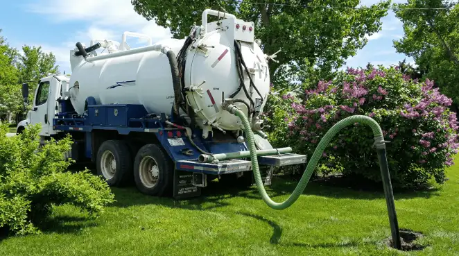 Professional vacuum truck performing residential drainage and septic maintenance in Sacramento, CA
